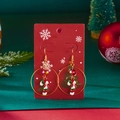 Macro detail of Christmas candy cane earrings with red beads on a festive card - Candy Cane Style (ER25Y0368-3)