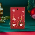 Detailed view of Christmas hoop earrings with Santa charm and red beads on festive card - Santa Claus Style (ER25Y0368-2)