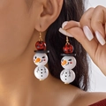 Boucles d'oreilles bonhomme de neige Noël avec perles bois à carreaux rouges et noirs et sourire - Bonhomme de Neige (Chapeau Plaid Rouge Noir Clin d'Oeil)