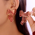 Exquisite festive earrings with red enamel bows and golden edges on a model - Red Bow Style (ER25Y0319)