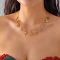Gold snowflake necklace with crystal charms worn by a model for a festive holiday style - Gold Snowflake Pendant Necklace (Style 3)