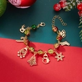Detailed view of Christmas charm bracelet with Santa, reindeer and colorful beads - Round Beads