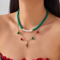 Detail of Christmas double-layer necklace with green beads, happy letters and tiny charms - Double Layer Green Soft Clay HAPPY Tree Style