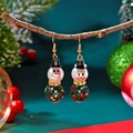 Detail of Christmas snowman earrings with pearls and colorful crystals on a branch - Colorful Rhinestone Green Snowman