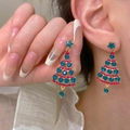Close-up of model wearing sparkling Christmas tree tassel earrings with heart crystals - Star Heart Christmas Tree Style (ER24Y0620 Green)