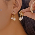 Elegant gold hoop earrings with sparkling snowflake and white pearl charms on model - 金色耳圈镶钻雪花白色珍珠挂坠款