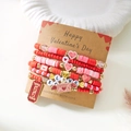 Close-up of pink beaded stretch bracelets with Be Mine heart and XOXO charms on a card - Envelope Emotion Heart Style (BR25Y0720-2)