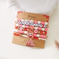 Close-up of handmade multilayer Valentine elastic bracelets with pink charms and letter beads - Strawberry Gnome Heart Style (BR25Y0720-3)