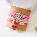 Detail of pink beaded heart bracelets set on a Valentine card with LOVE and HEART charms - Pink Glitter Heart Style (BR25Y0720-4)