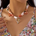 Detail of silk scarf necklace with colorful heart pendants on floral clothing - Graffiti Heart Pendant (NC25Y1033-2) / Orange