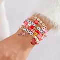 Roze kralenarmbandset met hartje en LOVE-letters in een meerlaags elastisch design - Zwart Raster Roos