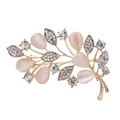 Detailed view of leaf brooch with pink cat eye stones and sparkling crystal accents - Light Gold Leaf With Pink Cat Eye Stone (16BC023)