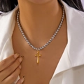 Detail of beaded necklace with grey beads and a gold cross pendant on a model - Metal Gray Bead Style (NC25Y1081-2)