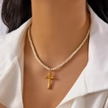 Cross necklace variant with gold pendant and cream beaded chain on a model - White Marble Bead Style (NC25Y1081-3)