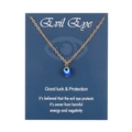 Goldene Halskette mit Evil Eye Anhänger auf einer dunkelblauen Geschenkkarte - 8mm / Gold