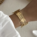 Golden multi-layer open bangle featuring retro sun relief patterns for women - Multi-Layer Sun Smile (BR25Y0784)