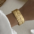 Golden wide open bangle with embossed sun pattern and vintage bohemian style - Sun Figure Relief (BR25Y0789)
