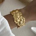 Golden sunflower wide cuff bracelet with embossed floral design for beach vacations - Blooming Sunflower (BR25Y0791)