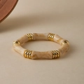 Detailed macro shot of marbled resin bamboo bracelet with elegant golden spacers - Creamy Beige Marble (AB0070-4)