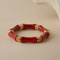 Detail of red bamboo-style beaded bracelet with textured gold spacers and resin beads - Red Marble (AB0070-7)