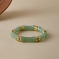 Detailed macro view of green bamboo-joint acrylic modules with gold textured ring links - Light Green Jade Texture (AB0070-8)