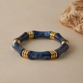 Detailed close-up of blue marble resin bamboo bracelet with golden textured metal rings - Dark Blue Marble (AB0070-10)