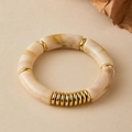 Detailed macro view of ivory marble resin beads and golden metallic rings on the bracelet - Off-white Marble Texture (AB0077-4)