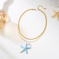 Collier double couche doré avec pendentif étoile de mer bleue et perle sur fond de corail - Acier inoxydable / Étoile de mer double couche