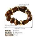 Close-up of irregular marbled acrylic beads with golden metal spacers on beach bracelet - AB0094-5