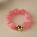 Detail view of pink marble texture resin beads and golden metallic accents on a bracelet - Random Texture/Shade / Sweet Pink (AB0075-7)