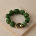 Detail of green acrylic beads and irregular gold metal accent on a textured stone base - Random Texture/Shade / Green Marble (AB0075-12)