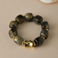 Detail of acrylic bracelet featuring black marble texture resin beads and gold accents - Random Texture/Shade / Black Gold Quicksand (AB0075-13)