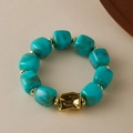 Detail of turquoise marble beads and textured gold irregular metal element on the bracelet - Random Texture/Shade / Turquoise Marble (AB0075-16)