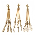Detailed set of three golden alloy tassel pendants with sword and dollar sign motifs - Teardrop Scimitar and Dollar Style (PX22)