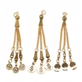 Detailed view of alloy tassel charms with palm tree, dollar sign, and leaf designs - Palm Tree Dollar and Leaf Vein Style (PX21)