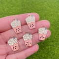DIY pink bubble tea alloy pendants for jewelry making shown on a natural background - Milk Tea