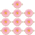 Close-up of 10 pink enamel daisy pendants with gold edges for DIY necklace jewelry making - Pink