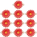 Close-up of red enamel daisy charms with gold metal edges for DIY jewelry making - Red