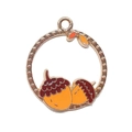 Macro detail of alloy double acorn pendant with gold frame and orange enamel finish - Hazelnut