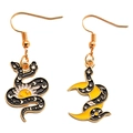 Close-up of asymmetrical celestial snake earrings with moon and star enamel details - Asymmetric Star Moon Snake Style (px0316-4)