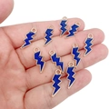 Close-up of royal blue enamel lightning bolt charms held in hand for scale and detail - Sapphire Blue