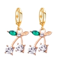 Elegant gold cherry drop earrings with green marquise stones and clear crystal accents - Gold White
