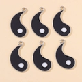 Detailed view of six black enamel yin yang pendant charms for DIY jewelry making - Black Yin Yang Fish Style