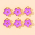 Detailed view of six purple enamel flower charms with gold edges for DIY jewelry making - Purple
