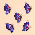 Detailweergave van 5 blauw en rode emaille vlinderbedeltjes voor DIY sieraden - Donkerblauw
