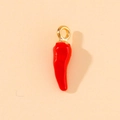 Macro shot of 3D red chili charm with gold loop for jewelry and accessory making - Red