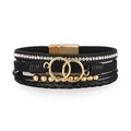 Close-up of multilayer leather bracelet with crystal chain and gold magnetic clasp - Black Gold (SZ00302-4)