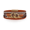 Close-up of bohemian multilayer leather bracelet with gold rings and magnetic clasp - Brown Gold (SZ00302-5)