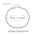 Detail of green faceted crystal necklace with 18K gold plated chain and size markings - 18K Gold / Dark Green Crystal Beads Style (KN0010)