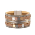 Close-up of bohemian multilayer leather bracelet with rhinestones and magnetic clasp - Champagne